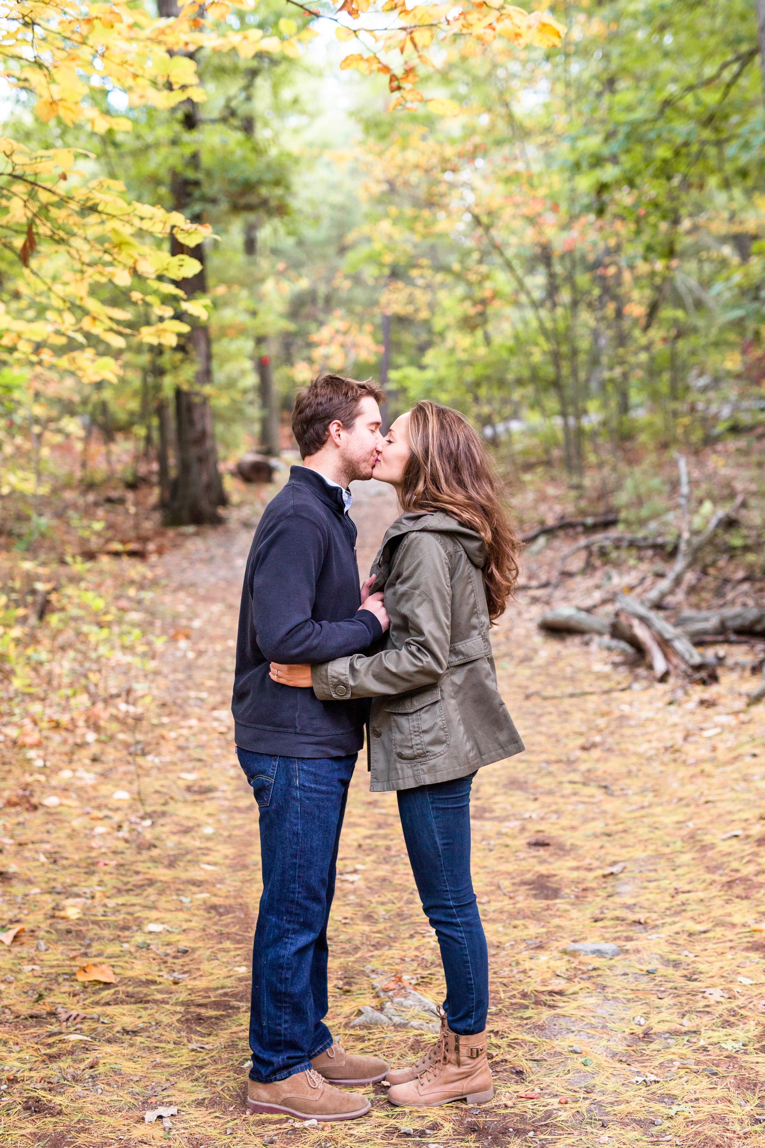 couple kissing during the fall in the Middlesex Fells
