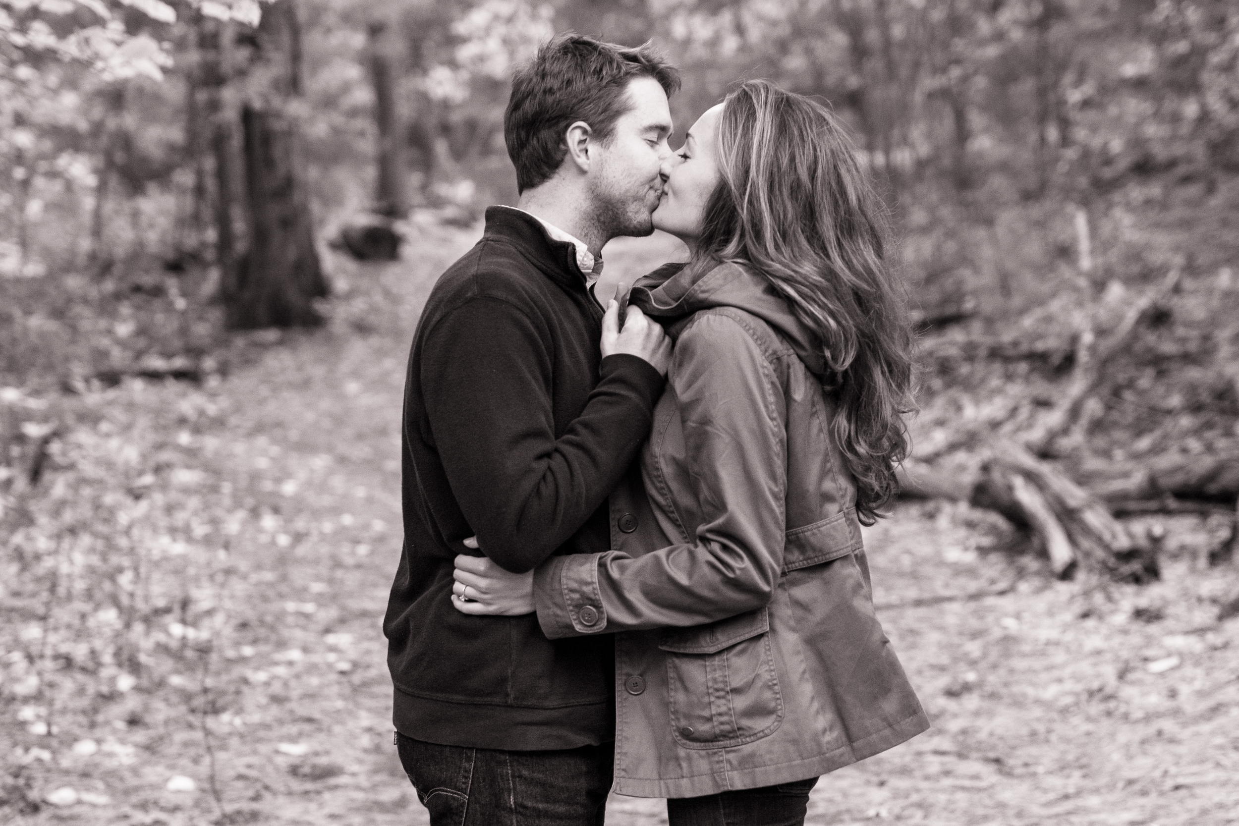 black and white photo of couple kissing in the middlesex fells