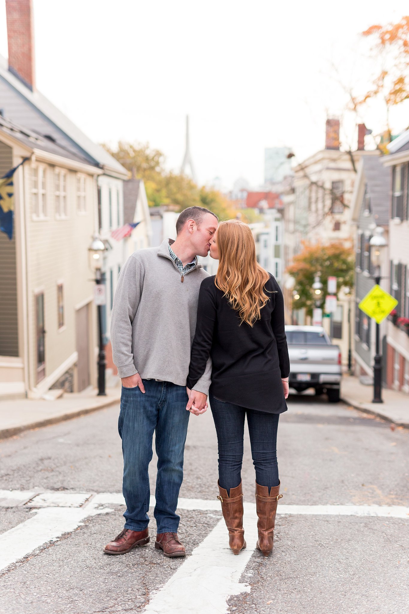 charlestown engagement session with couple standing in the street