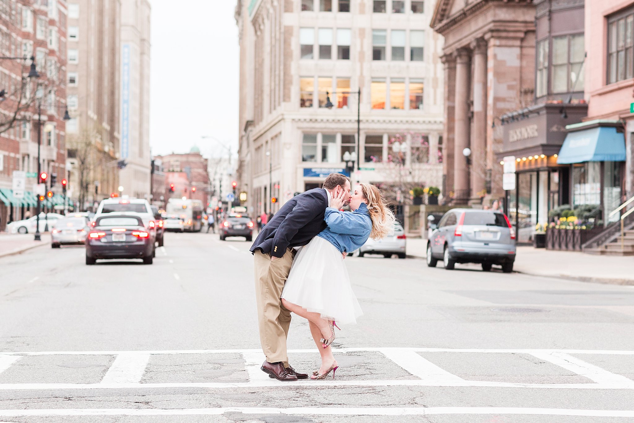 Couple kissing in the middle of street in downtown Boston