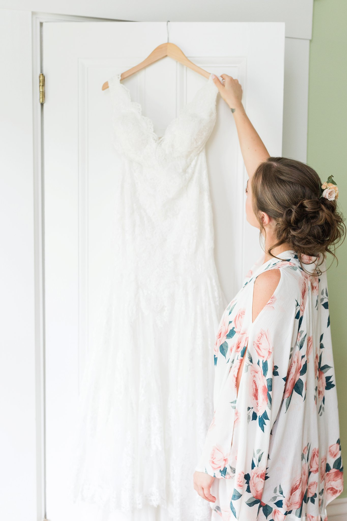 bride reaching for her dress