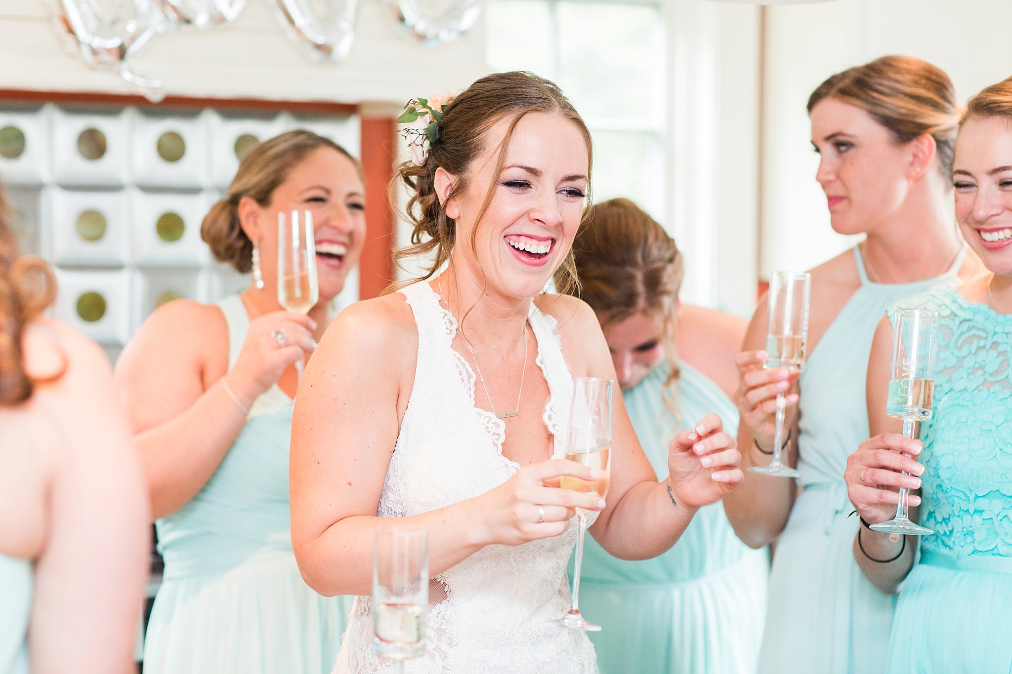 bride and bridesmaids champagne toast