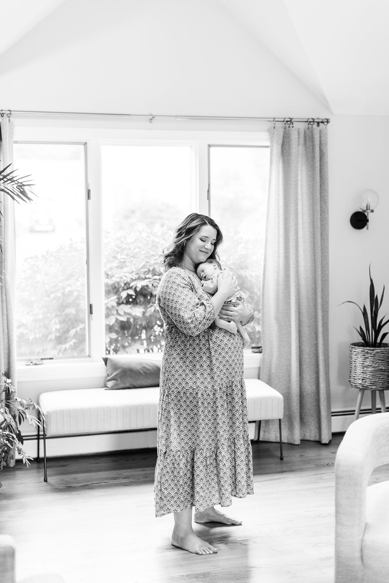 Black and White photo of mom holding her baby