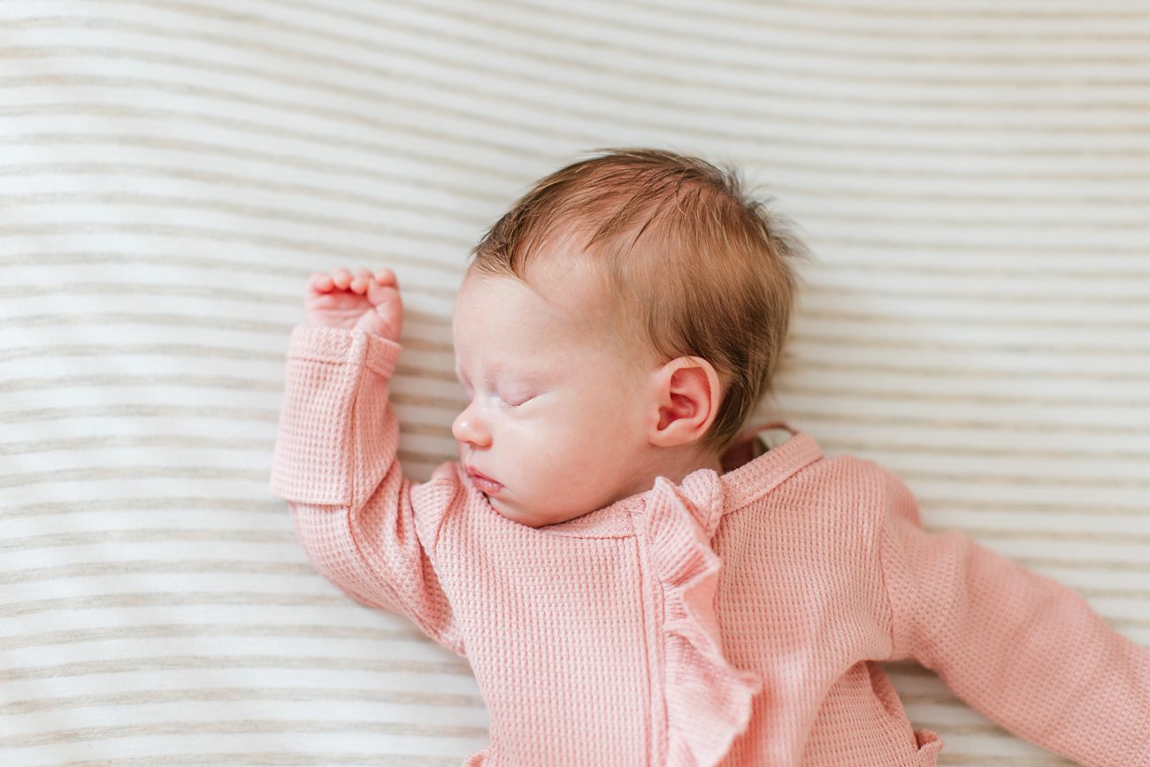 newborn laying in her crib in her home in Boston