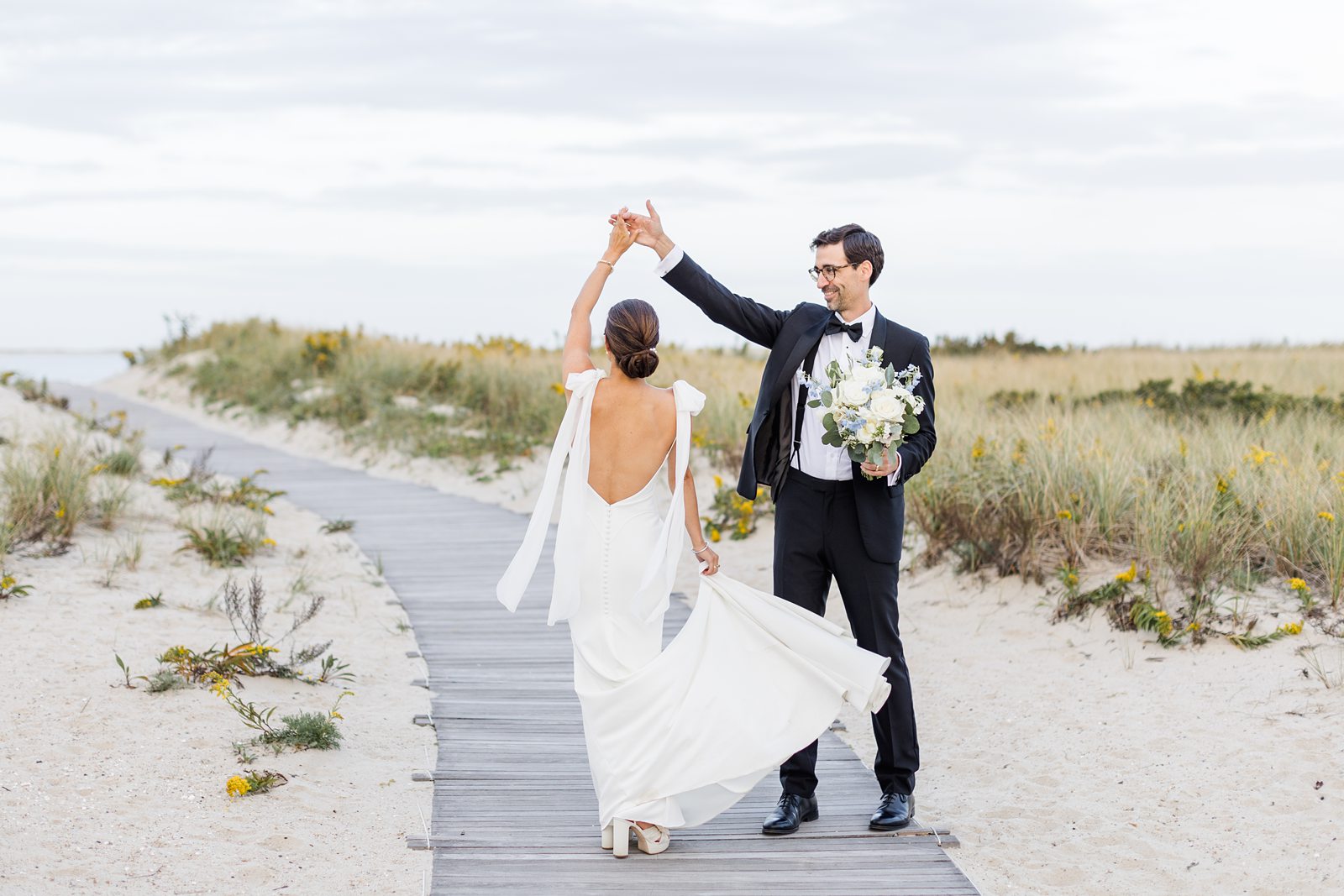 bride and groom on path at Chatham Bars Inn