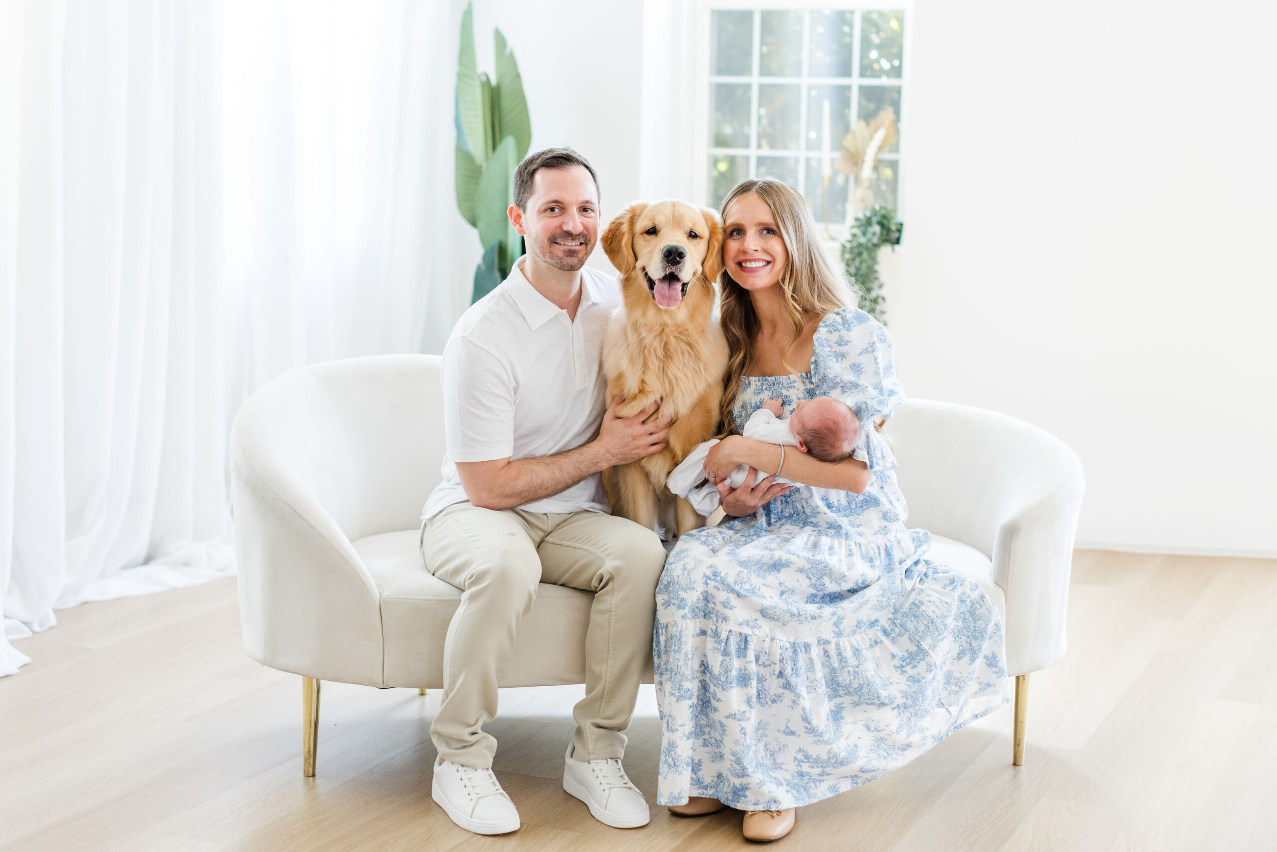 Family posing for a studio newborn photoshoot