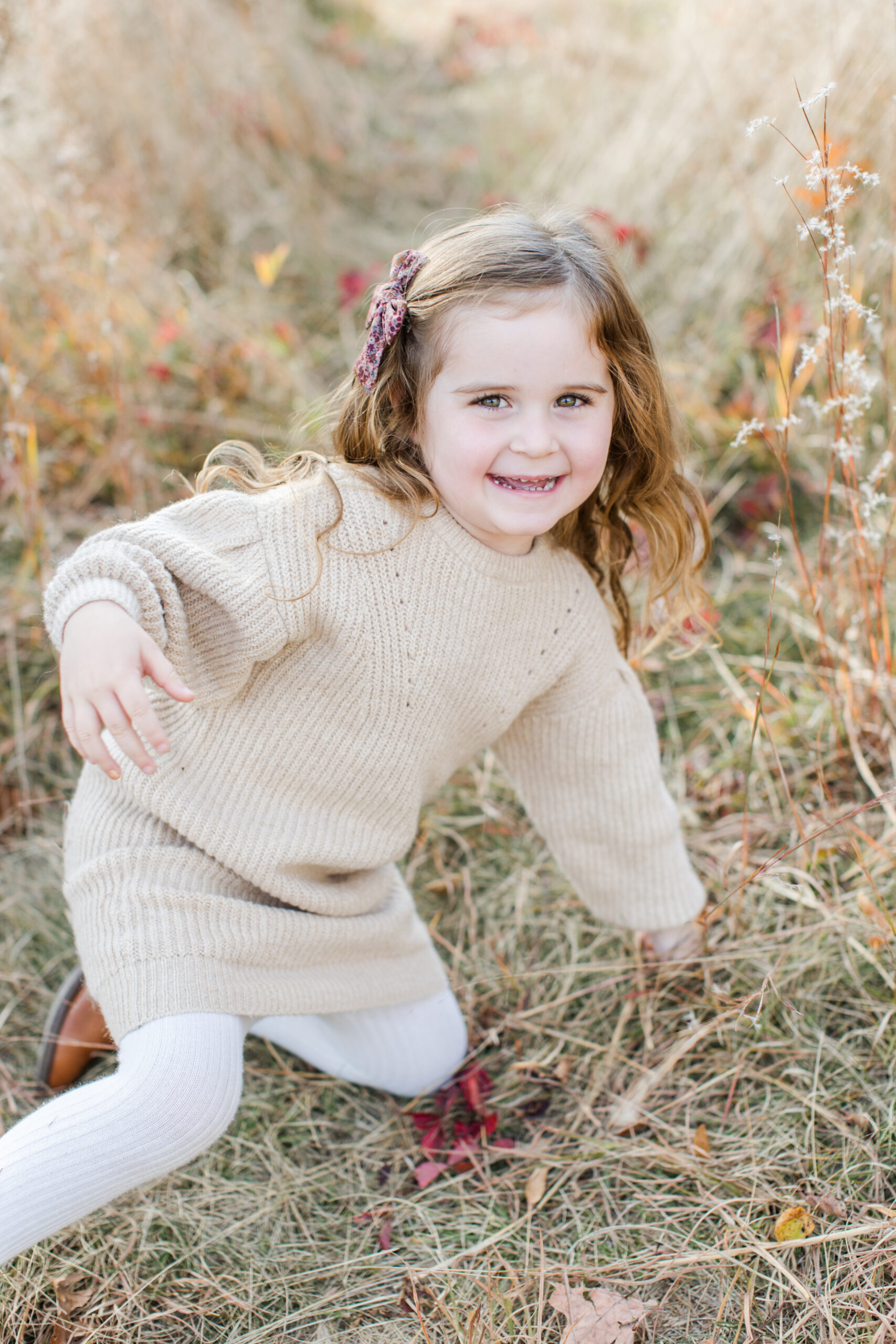 A little girl during a fall family photoshoot