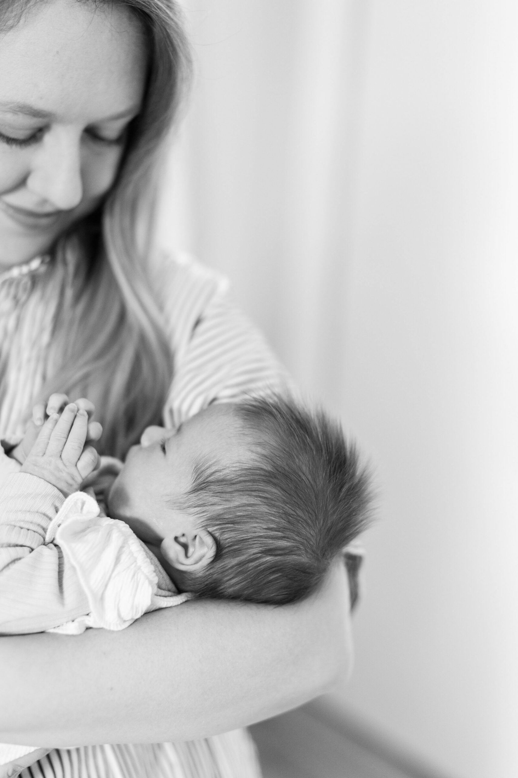 A black and white photo from a newborn photoshoot of a baby's hair