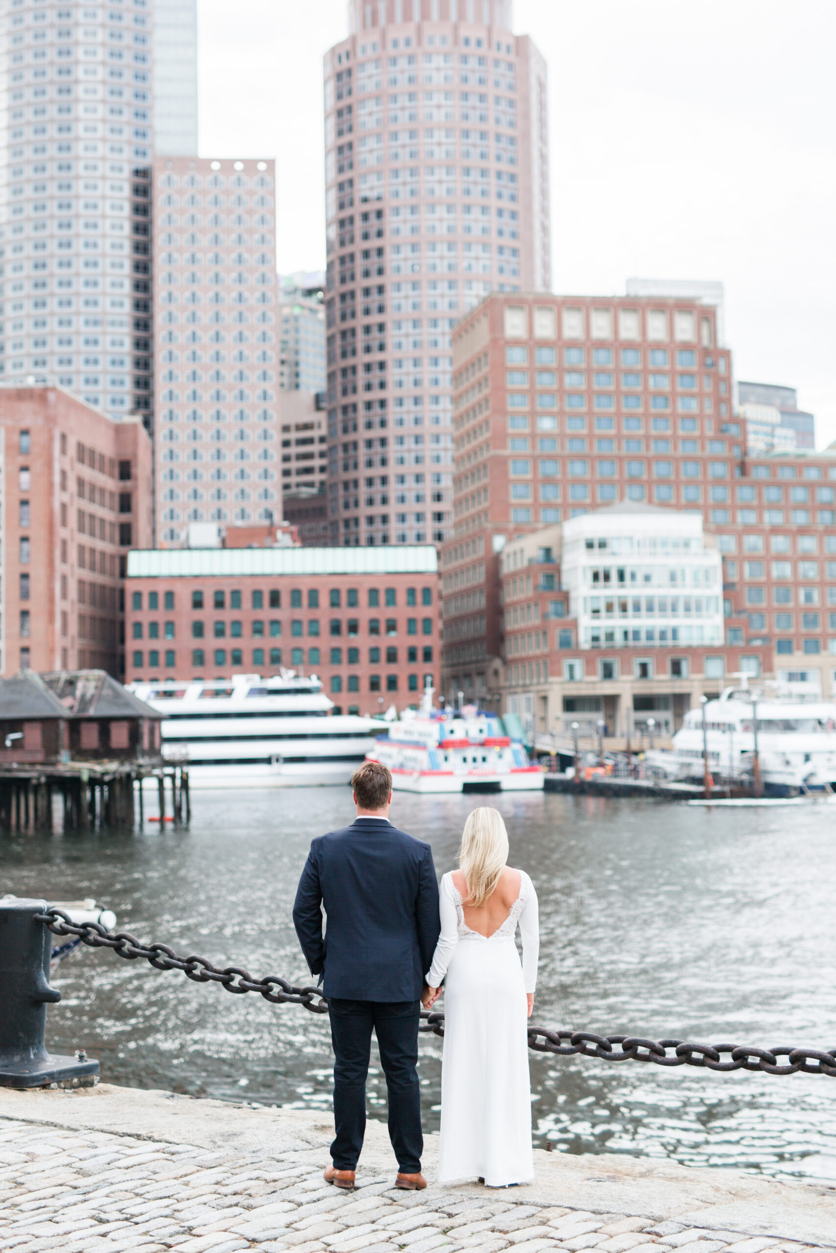 A couple looking at the city from one of my favorite Boston engagement photo locations