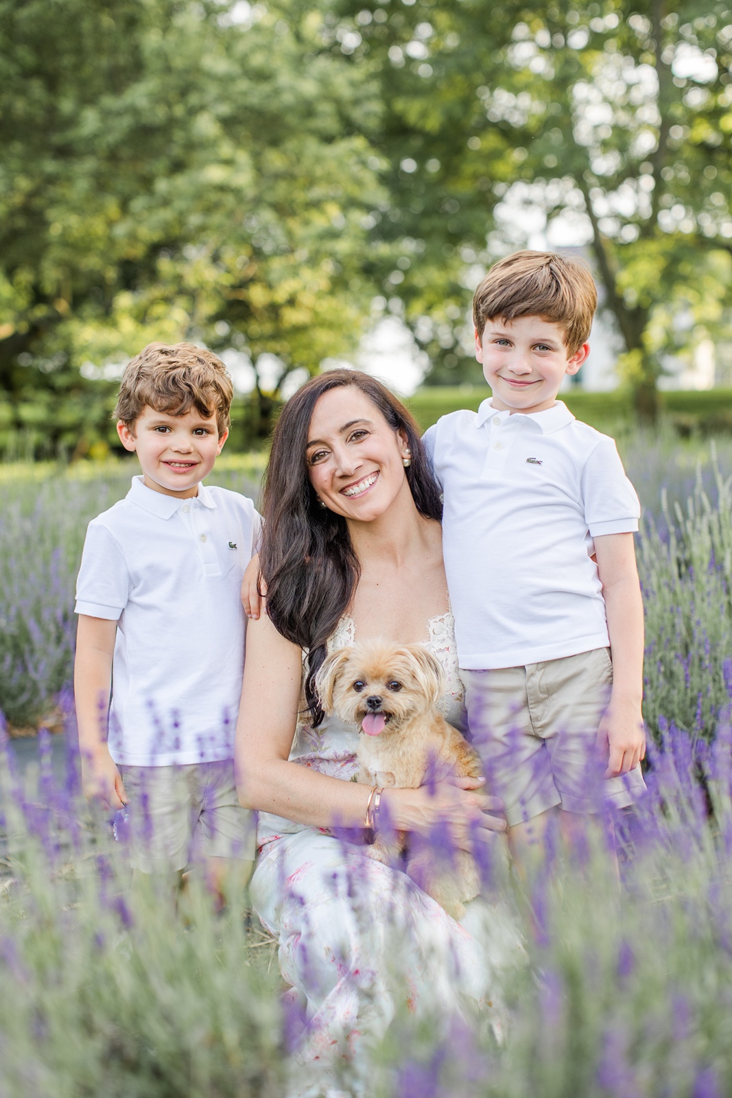 Woman with two small children and dog during Boston family photos with dogs