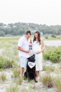 Couple with dog on beach during Boston family photo session