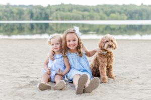 Children smile during their Boston family photos with dogs